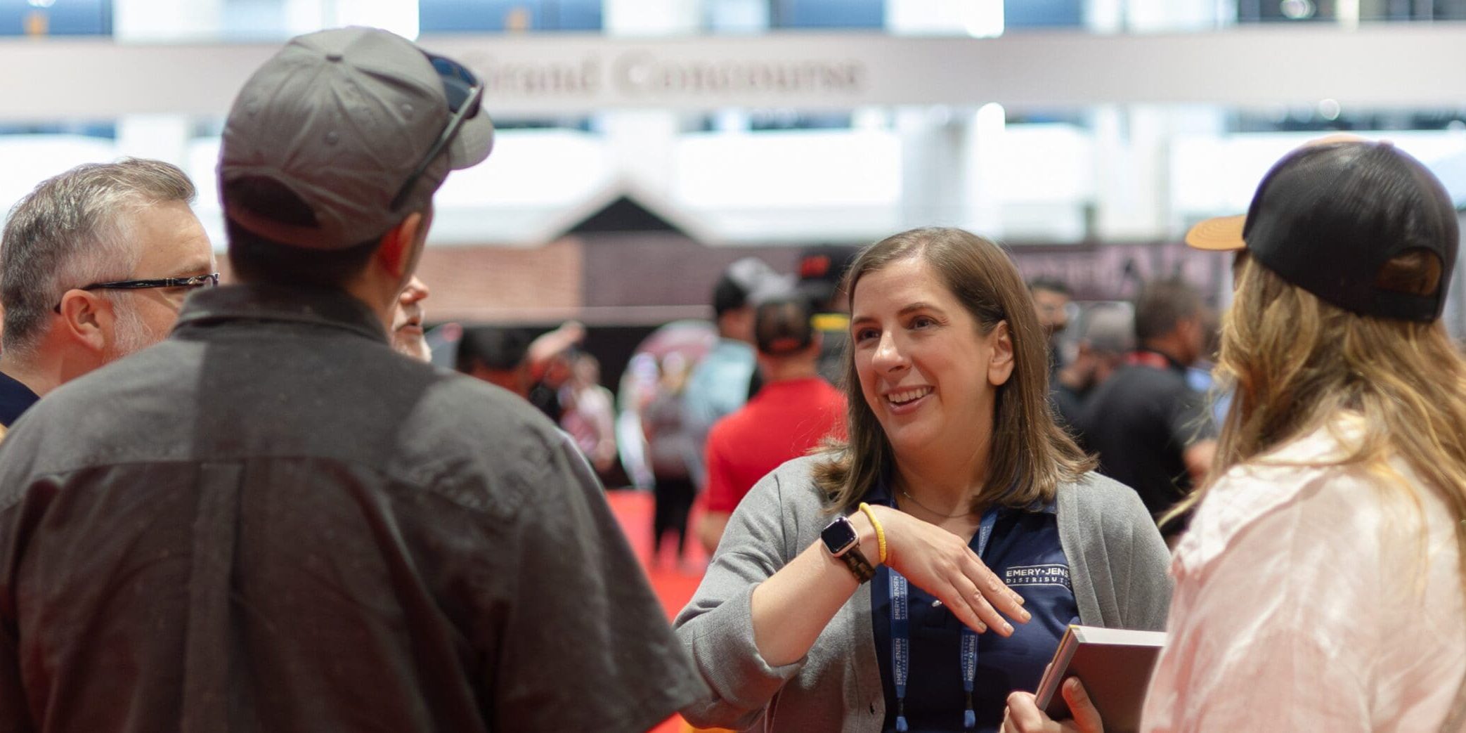 People conversing at a conference or event.