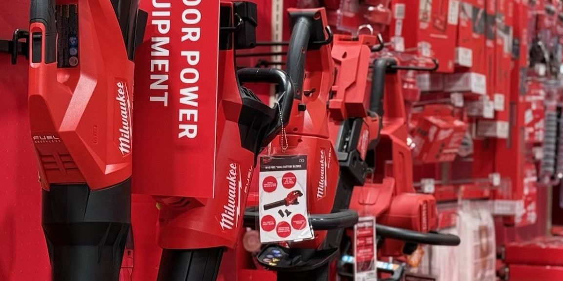 Red outdoor power tools displayed in store aisle.